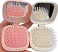 Brosse à cheveux miroir intégré